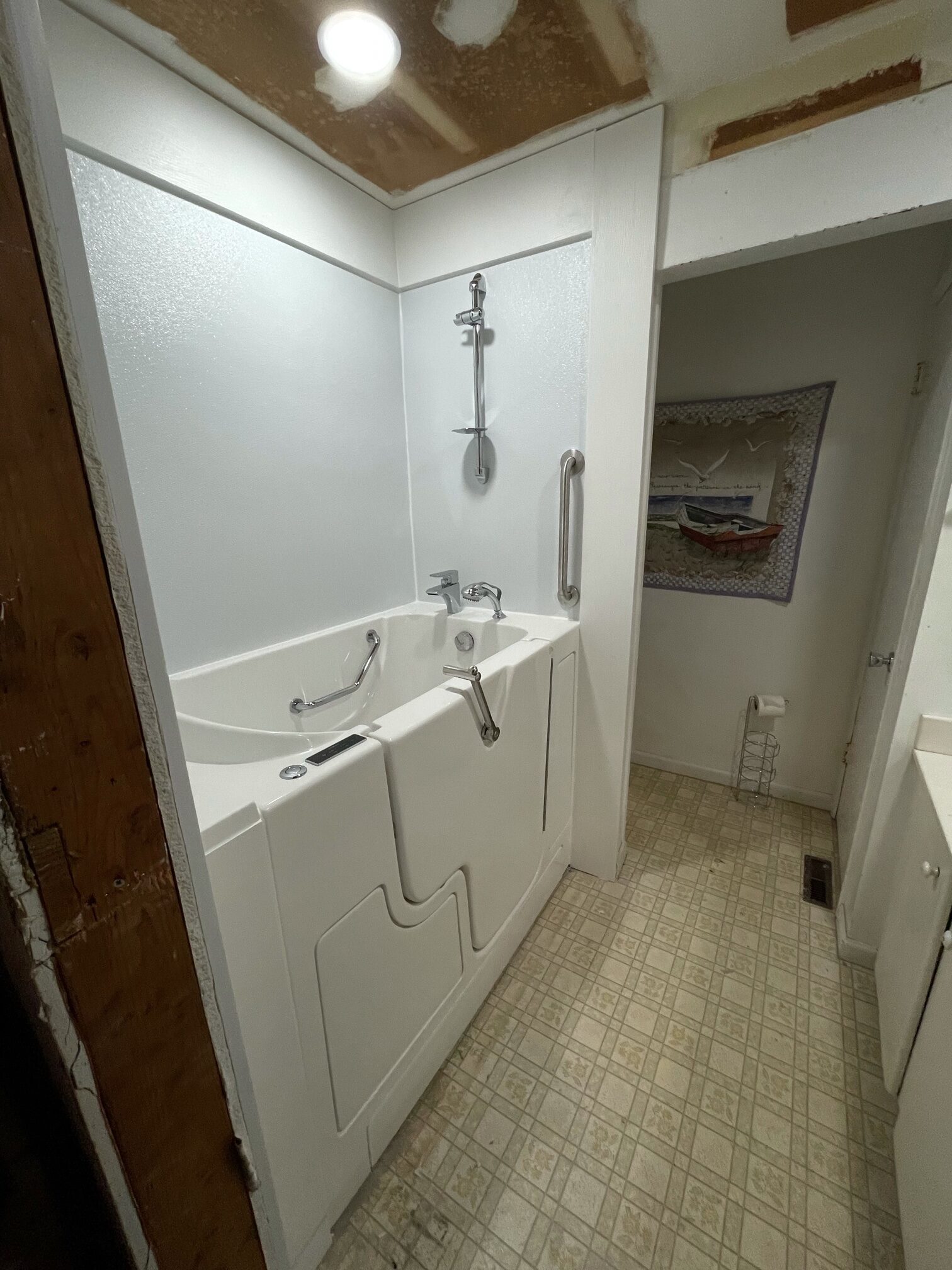 after picture of outward swing walk in tub